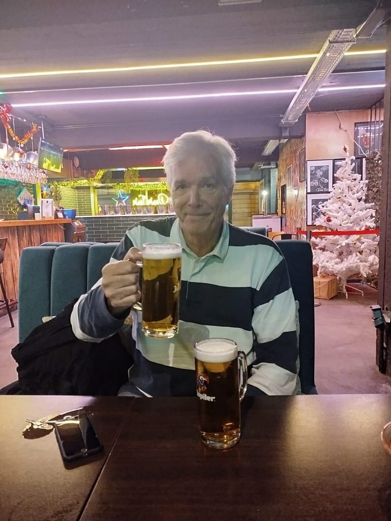 Nick Hirst in a bar with two beers